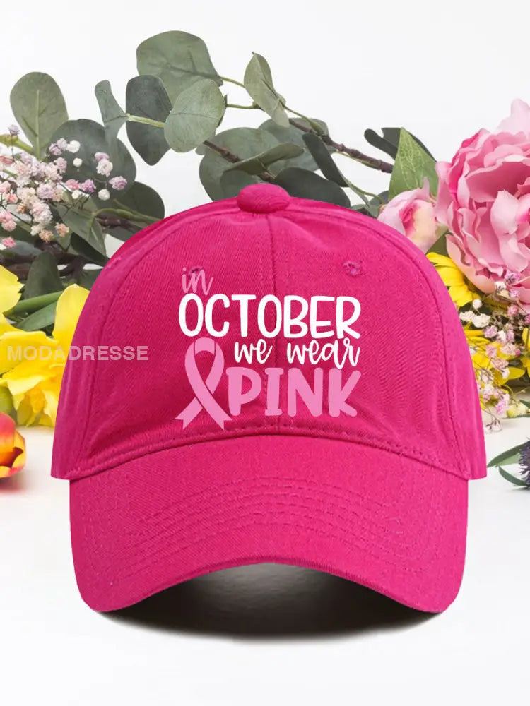 I oktober bär vi rosa bröstcancer neutrala hattar. rosröd / ONE