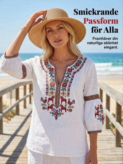Dams blus i vintagestil, inspirerad av den svenska midsommartraditionen, i bomull och linntyg